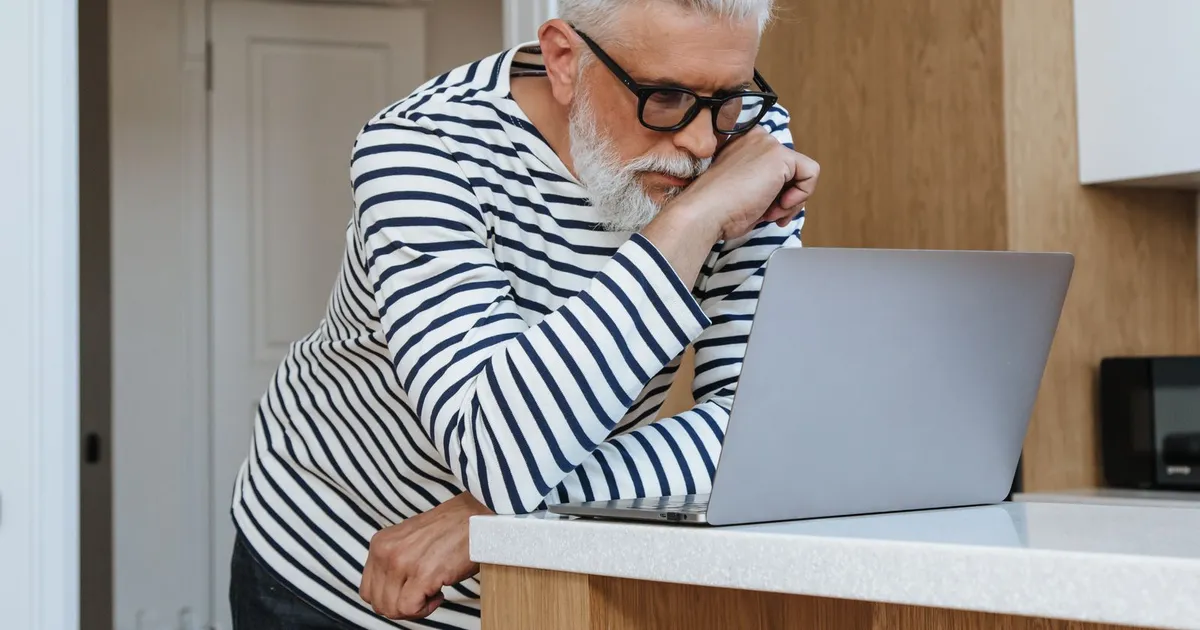 Person calmly reviewing bank statements at home before applying for bad credit loans Hamilton lenders decide on income