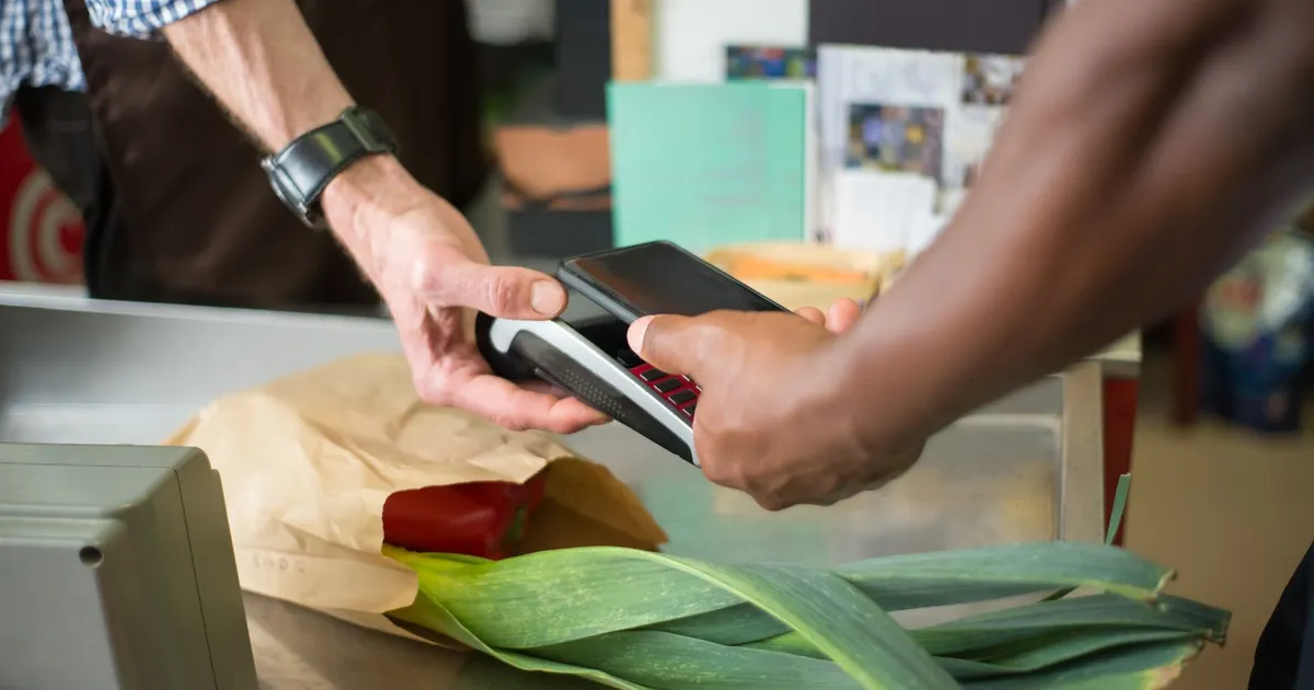 Paycheque deposit shown in a banking app on a phone, the cheque a cash advance Hamilton lenders make is repaid from